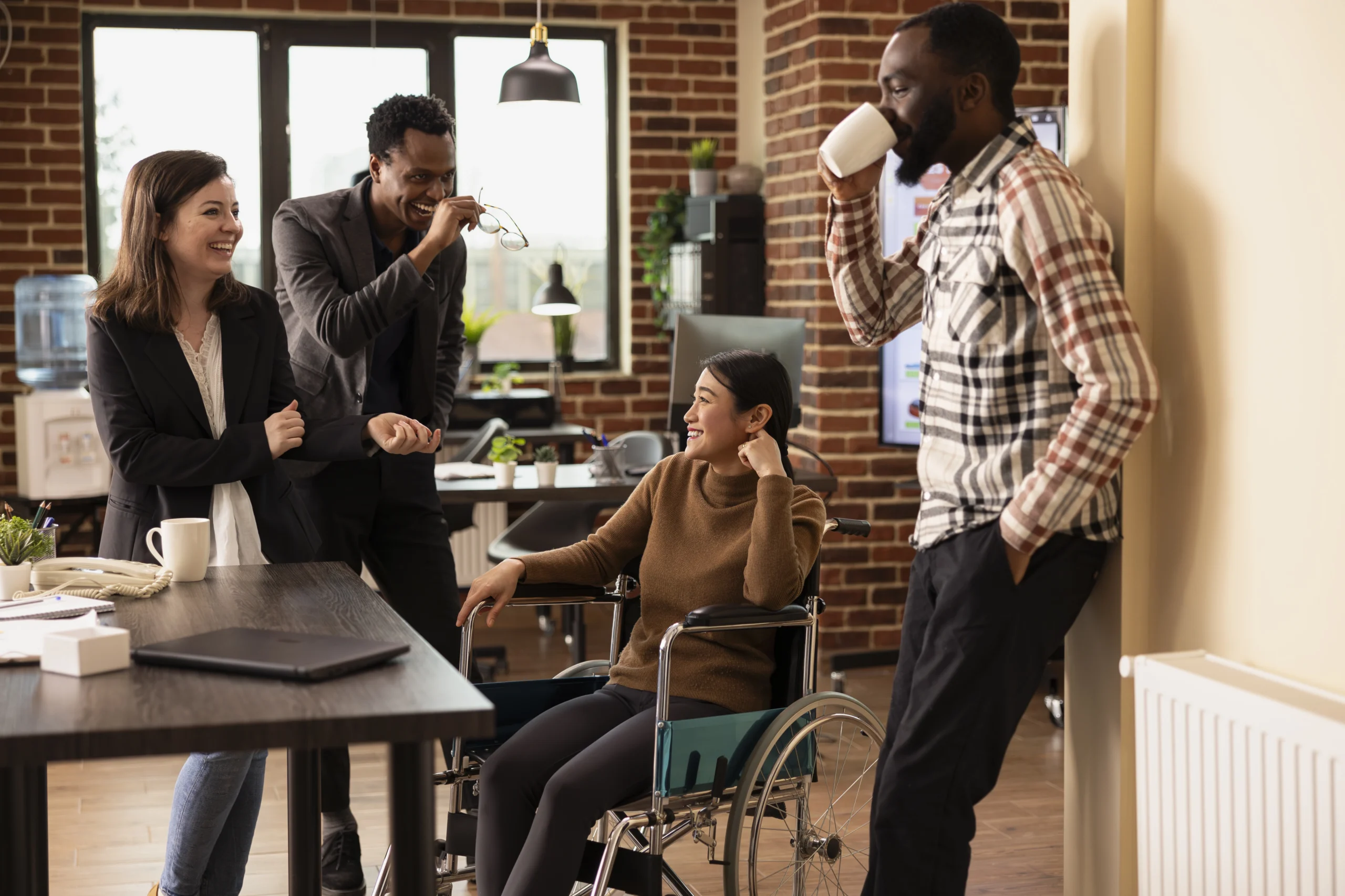 multiethnic-employees-bonding-office